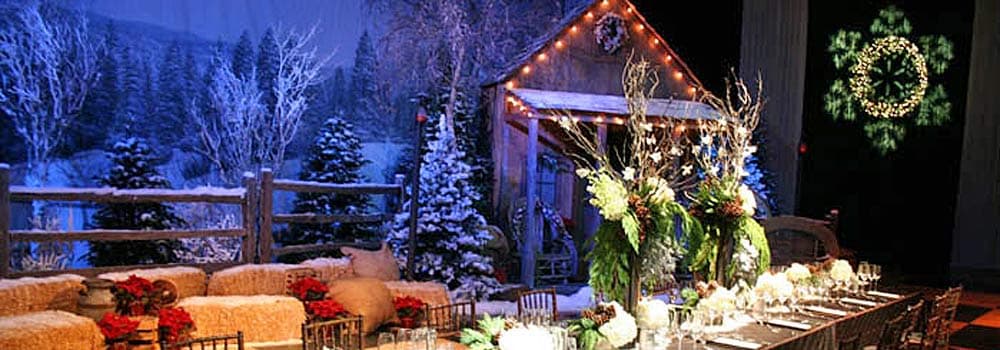 Winter wonderland Christmas party production — alpine lodge styling, festive lighting and elegant dining atmosphere