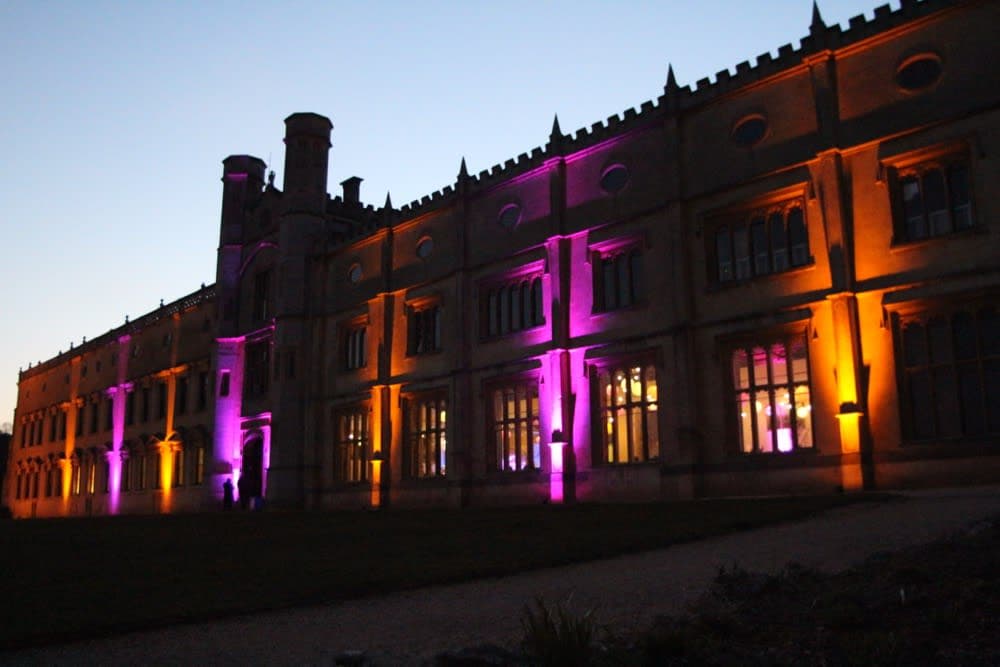 Marquee interior with dynamic party lighting and mirror balls above the dance floor