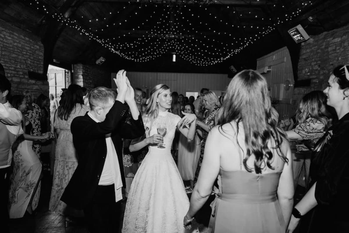 Mells Barn wedding with fairy lights installed in the barn ceiling