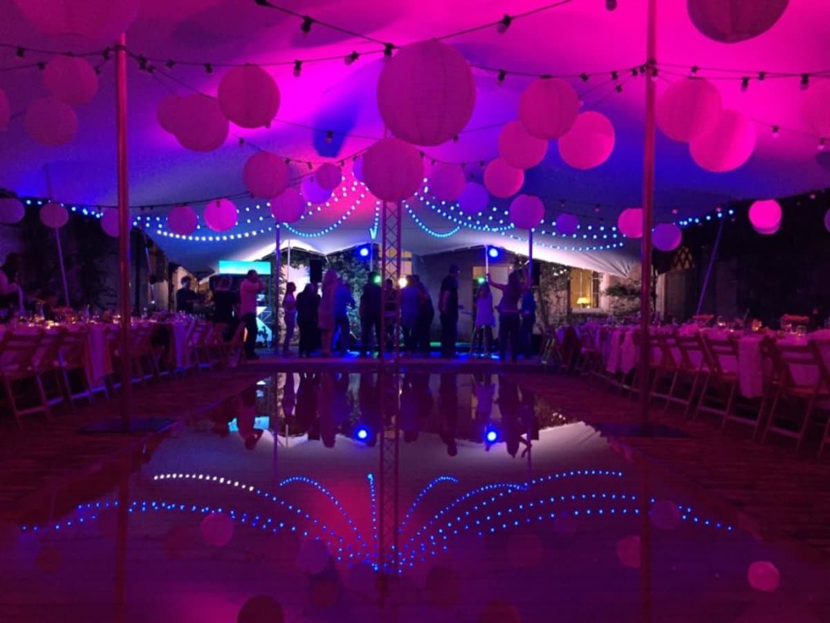 Stretch marquee with festoon lighting for a wedding celebration