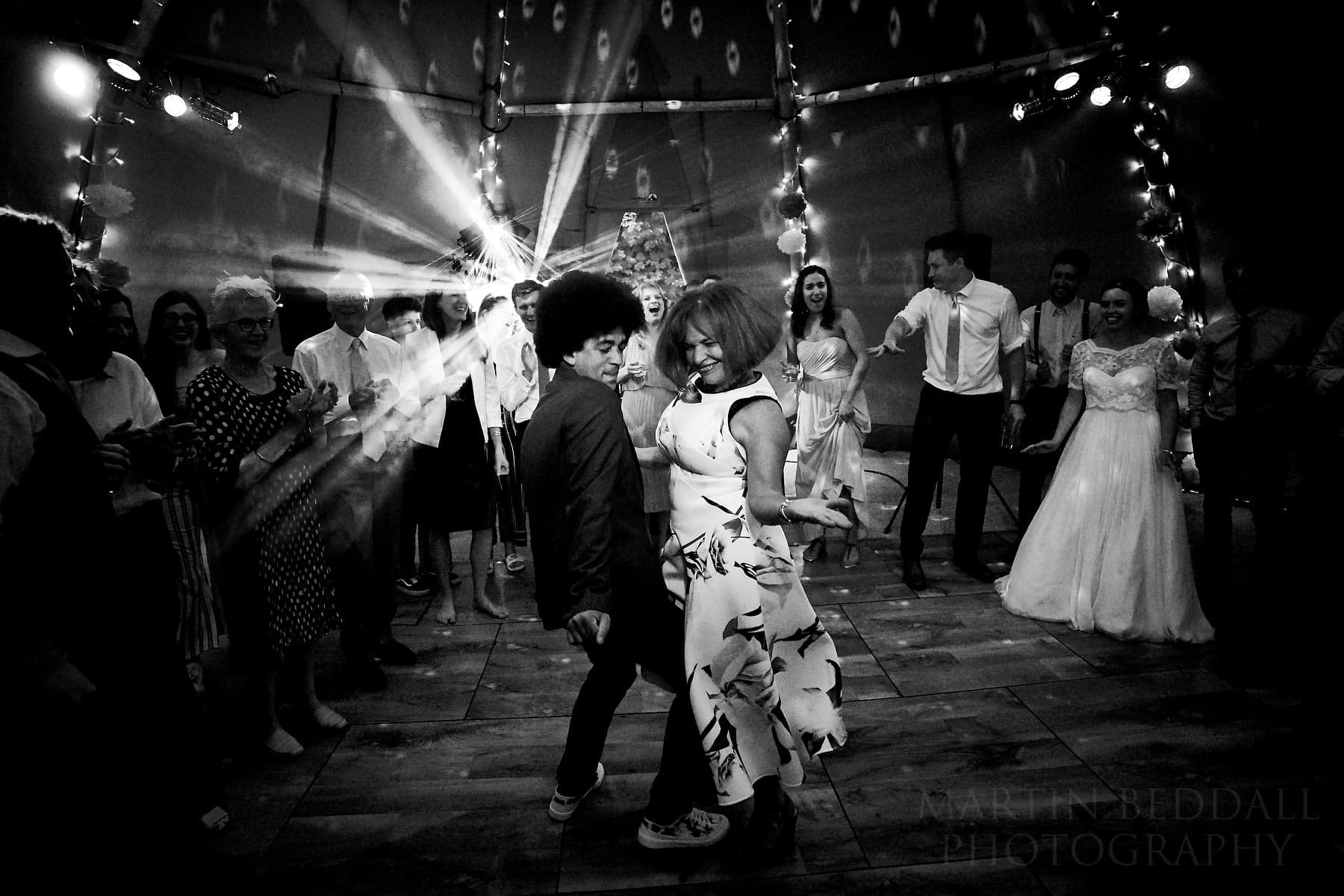 Packed wedding dancefloor with guests dancing — Martin Beddall Photography