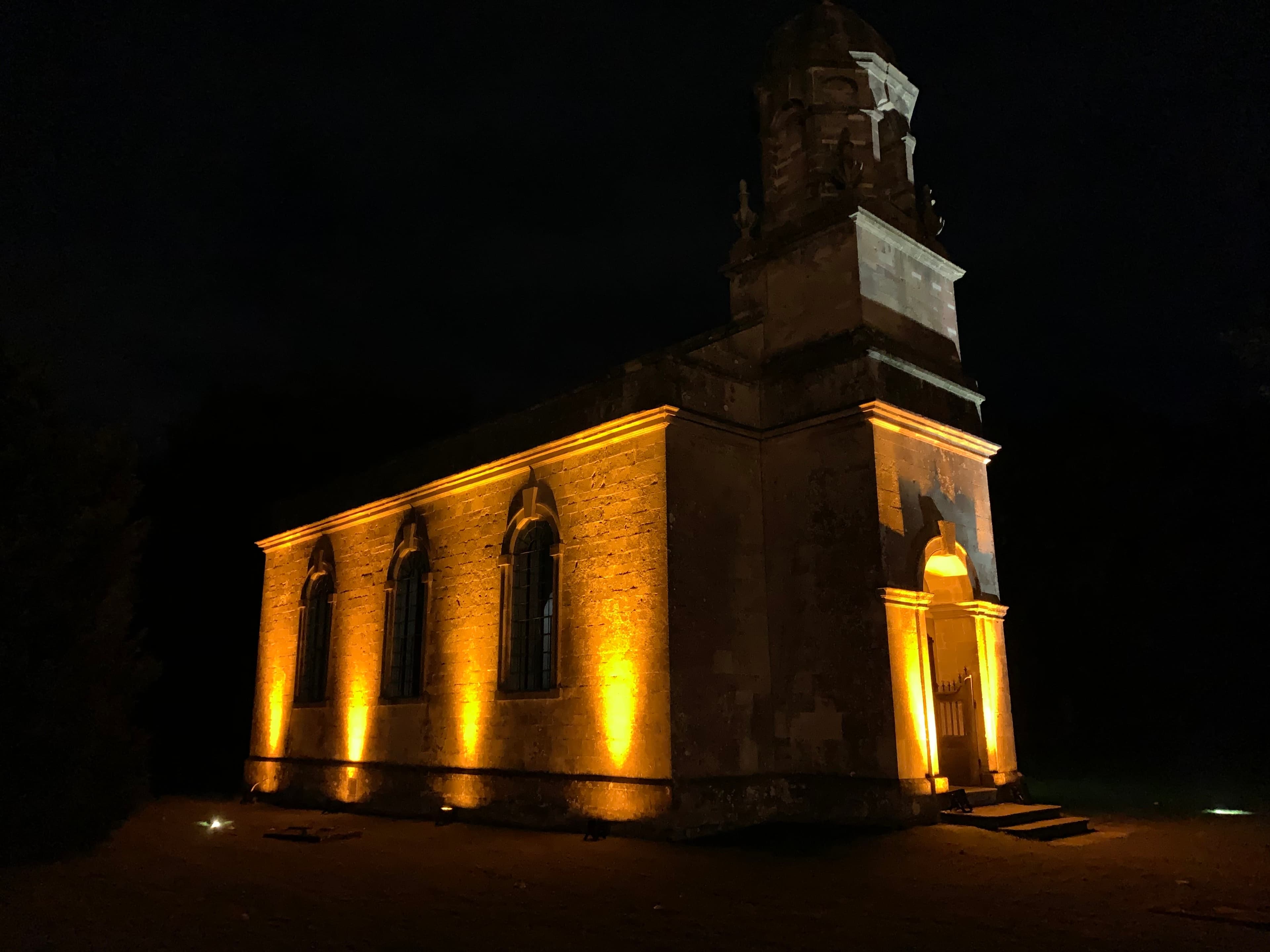 Church exterior lighting for evening wedding ceremony