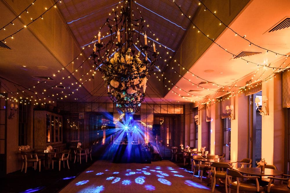 Babington House grounds with festoon and feature lighting creating a magical outdoor party setting