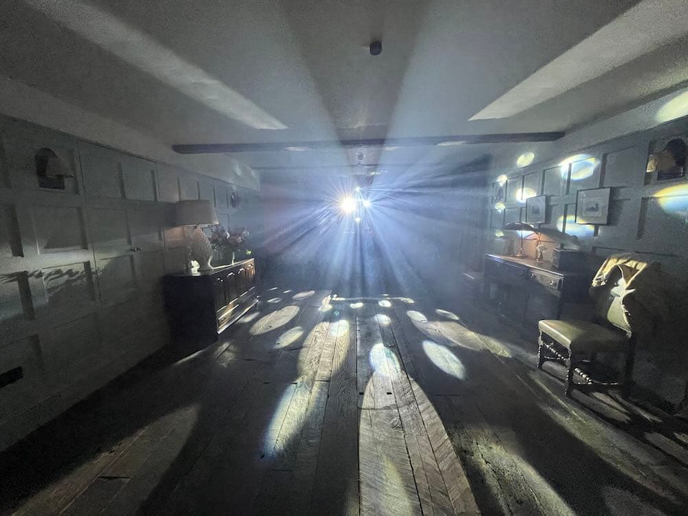 DJ Nige performing at Soho Farmhouse with vibrant party lighting and full dance floor