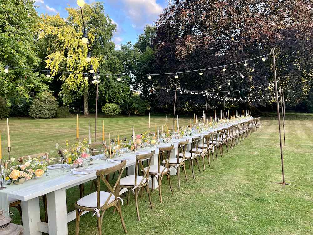 Babington House alfresco dining setup ready for evening party lighting and entertainment