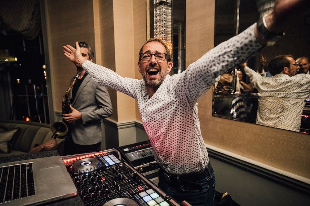 DJ Nige performing at Babington House, showcasing professional wedding DJ services with elegant lighting