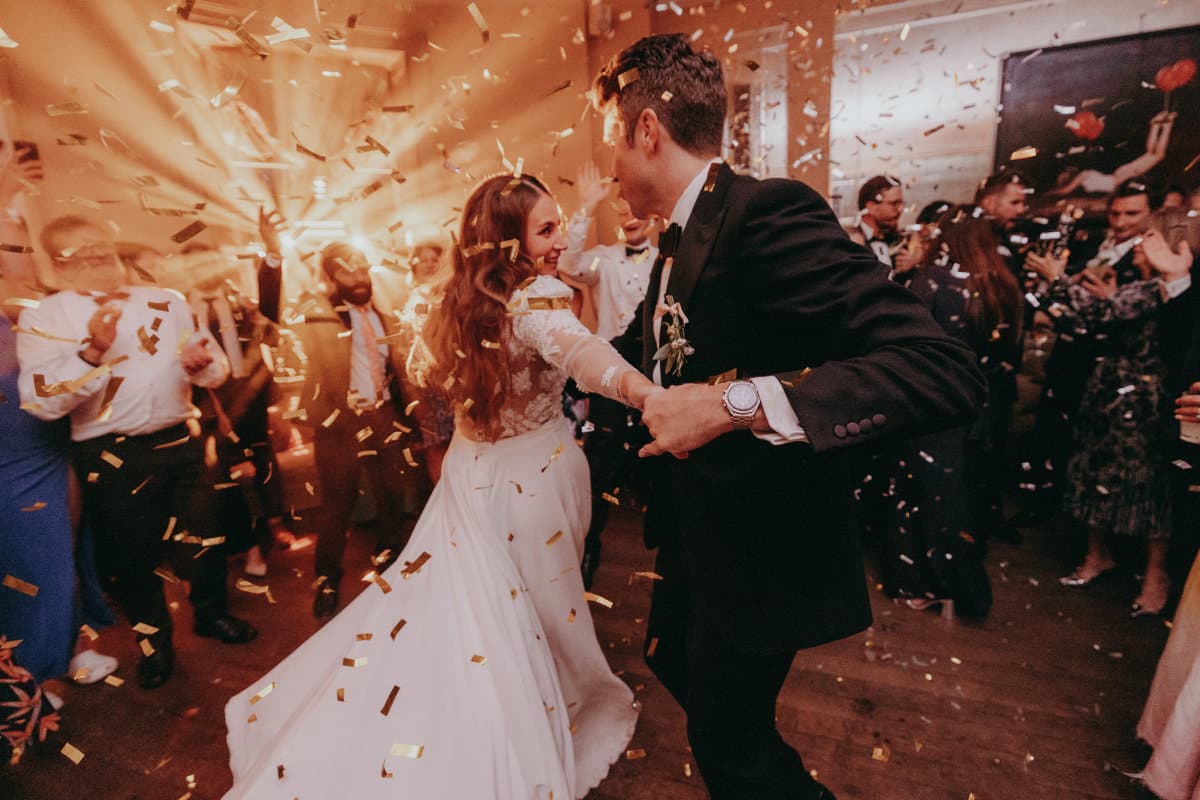 Camilla and Richard's wedding reception with elegant lighting design, beautiful table settings, and atmospheric wedding lighting