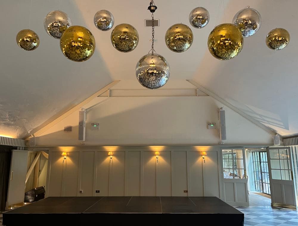 Kin House venue with elegant mirrorball clusters and professional lighting design creating a sophisticated party atmosphere