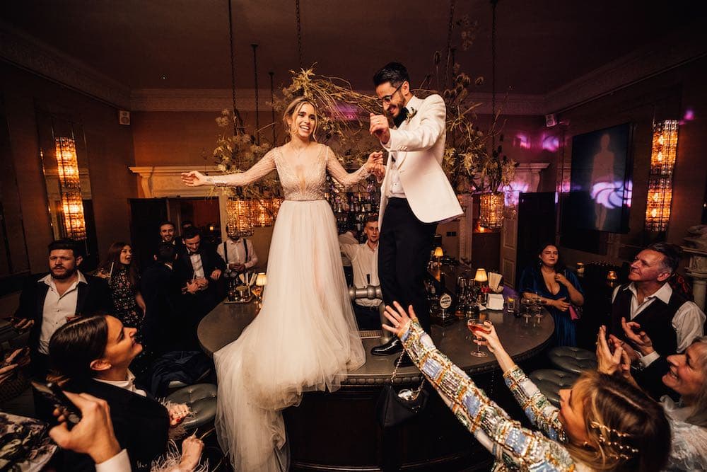 Professional DJ setup at Babington House with custom lighting, professional sound equipment, and atmospheric wedding entertainment